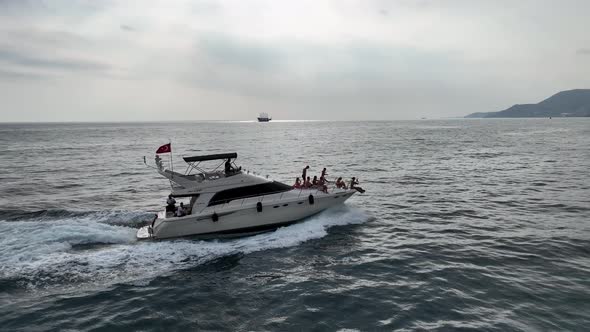 People dancing on a yacht aerial view 4 K Turkey Alanya alt