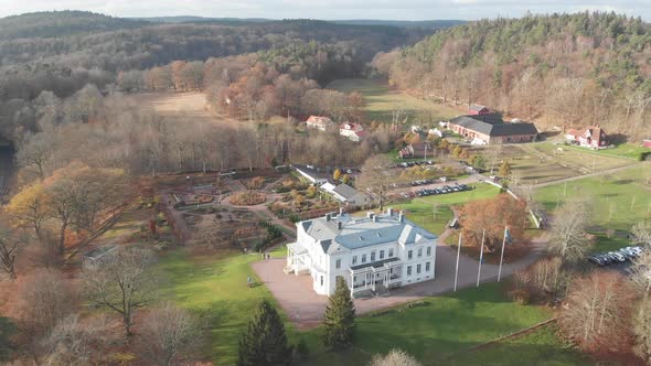 Flying Towards White Mansion and Beautiful Garden Autumn Aerial alt