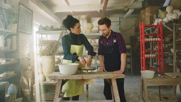 Man and Woman Are Working In Pottery