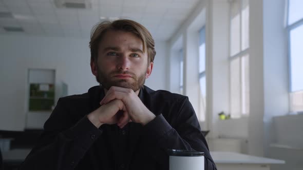 Man Sits and Thinking About His Boring Work alt