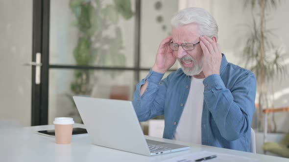 Senior Old Man Having Headache While Using Laptop in Office alt