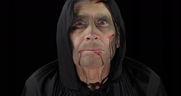 Old Executioner Halloween Makeup and Costume. Elderly Man with Blood on His Face alt