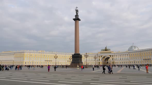 Tourists and City Dwellers Are Walking on Palace Square in Saint Petersburg in Cloudy Day
