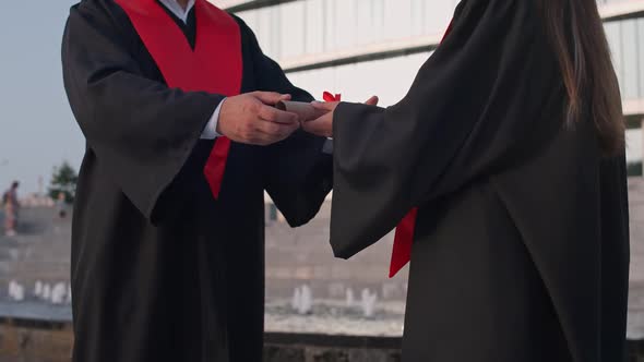 Graduation Ceremony Senior Lecturer Presents a Diploma to a University Female Graduate a Solemn alt