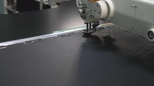 Robot Sewing Machine. Computer Controls the Sewing Machine. Automatic Sewing Machine. Automated alt