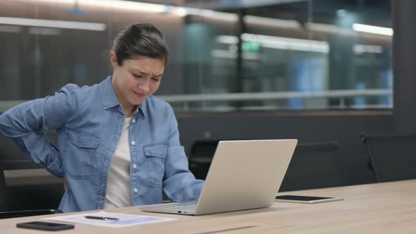 Indian Woman Having Back Pain While Using Laptop alt