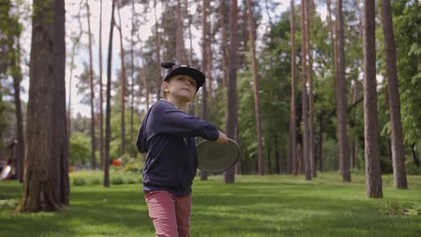 Slow Motion Shot Of A Cute Girl Throwing A Frisbee alt