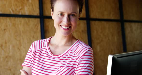 Female executive at her desk in office alt