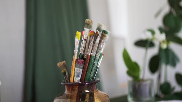 Old Drawing Brushes are Stored in a Stand