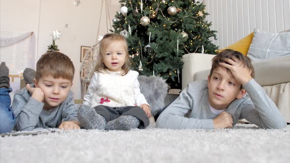 Children Playing with Railroad at Home Together in Christmas Eve alt