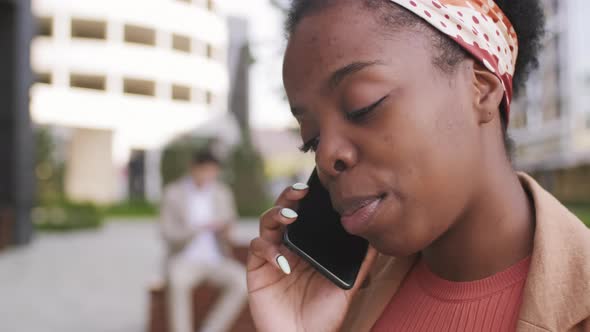  Close Up of Black Woman Talking on Mobile Phone alt