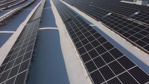 Solar Panels Power Station in Desert at Winter Morning Aerial View