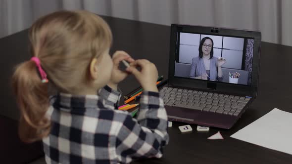 Children Distance Education on Laptop. Online Lesson at Home with Woman Teacher alt