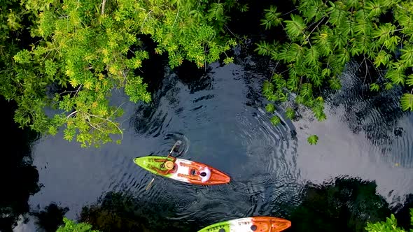 Couple in Kayak in the Jungle of Krabi Thailand Men and Woman in Kayak at a Tropical Jungle in Krabi alt