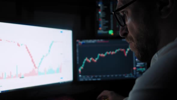Male Trader Analyzes the Stock Market alt