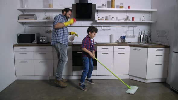 Dancing Happy Family Cleaning Up House Together alt