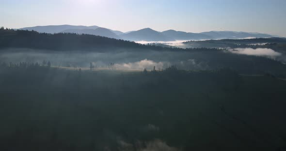 Fog In The Mountains Of The Carpathians. Sunrise Over The Mountains