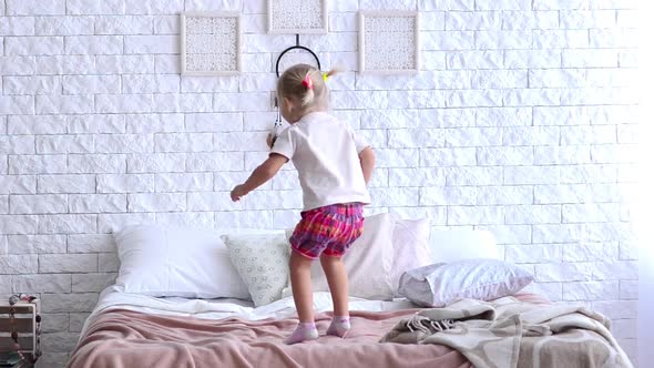 Child Jumping on the Bed