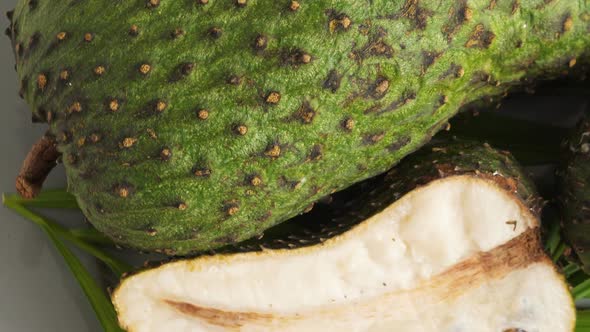 Closeup of Green Soursop Graviola, Exotic, Tropical Fruit Guanabana on Plate alt