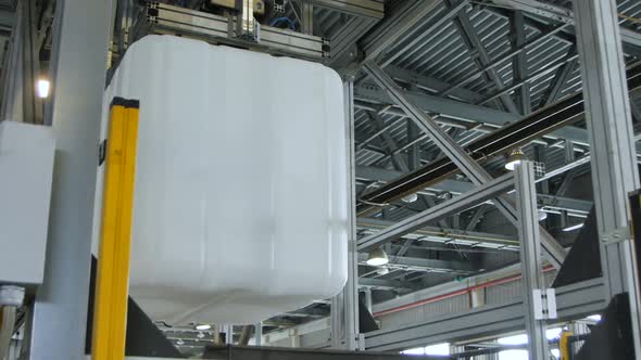 Plastic Cubic Container Transported By Crane Machine alt