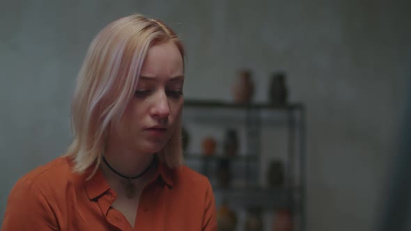 Portrait of Inspired Painter Creating Picture in Art Studio alt