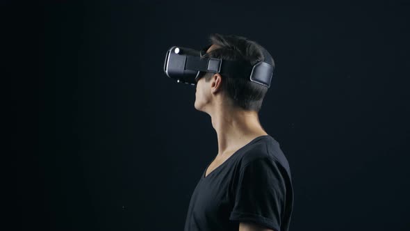 Closeup Shot of Man Getting Experience in Using VRheadset