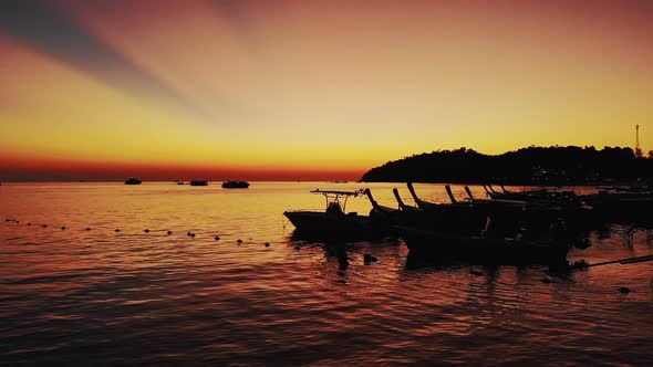 The Silhouettes of the Boats in the Adaman Sea During the Sunset