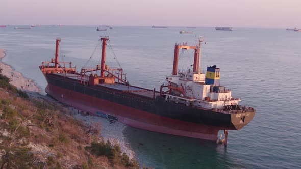 The Ship Ran Aground. Environmental Pollution at Sea. Aerial View. Grounded Ship. Drone Footage alt