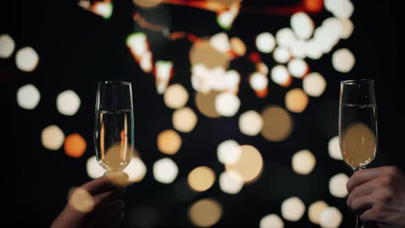 A Loving Couple are Clinking Glasses at Party alt