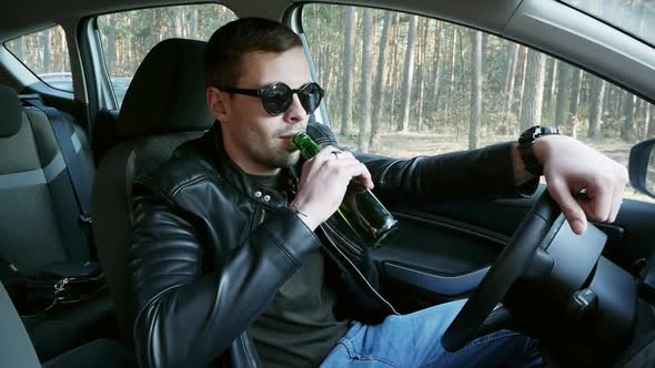 Drunk Driver Drinking Beer While Driving, Traffic Offense alt