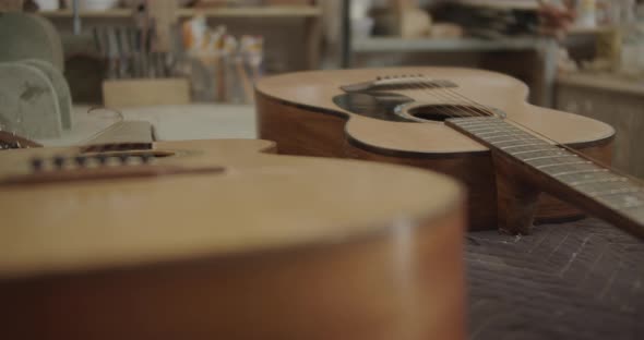 Pan left of hand made guitars close up
