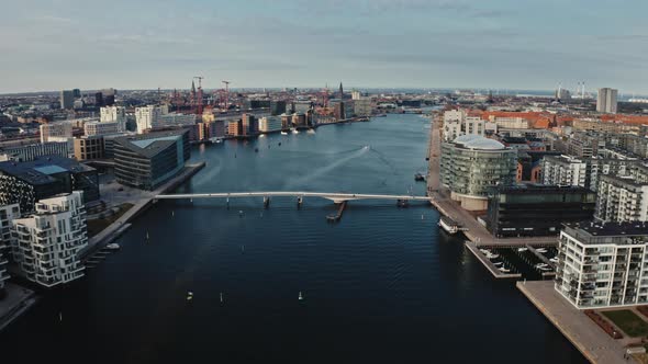 Panoramic Drone Shot of Bridge Surrounded By Buildings in Denmark alt
