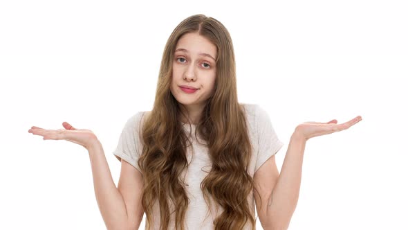 Portrait of Caucasian Female Teenager in Casual Outfit Throwing Up Hands in Perplexity Meaning Dont alt