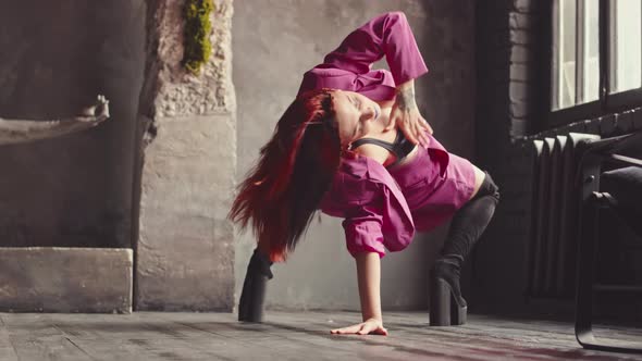 Eccentric Girl in High Boots Dancing Vogue in Studio alt