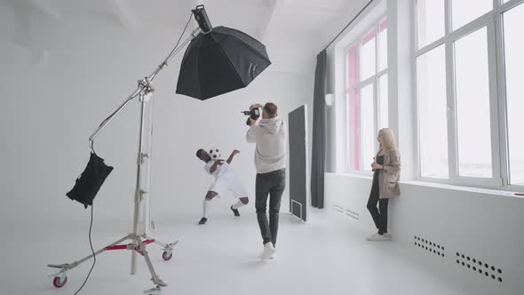 Art Director Checking the Photos on a Monitor alt