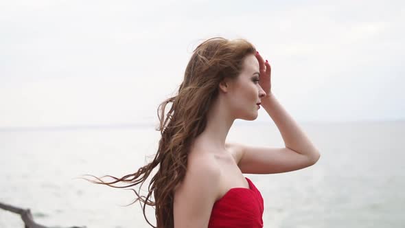 Woman Profile in Background of Sea in Windy Summer Day Closeup alt