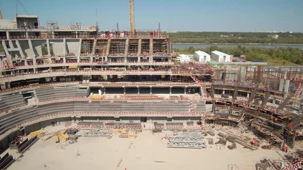 Sports Stadium Field with Supplies Against River in Summer alt