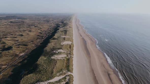 Drone Flies Over Long Ocean Shore in the Wildness on a Summer Day