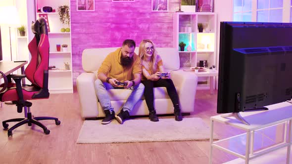 Bearded Boyfriend Playing Online Games with His Beautiful Blonde Girlfriend alt