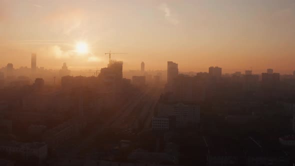 Smoke Over the City at Dawn