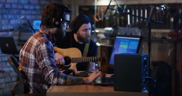 Young Musicians Playing in Home Studio alt