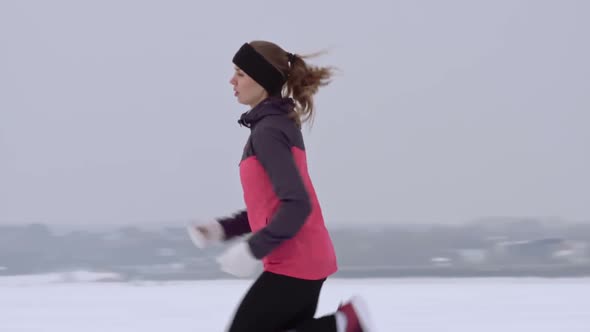 Woman Practicing Winter Cross-Country Running alt