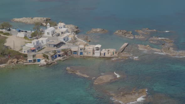 Slow Aerial Tilt Up of the Fishing Village of Mandrakia in the Island of Milos alt