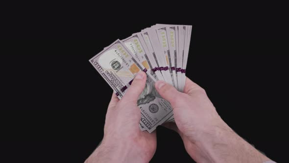 Male Hands Counting a Lot of 100 American Dollar Banknotes with Alpha Channel alt