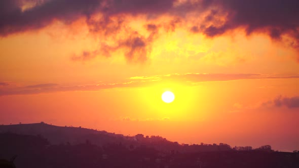 Sunset Over Horizontal Dark Cloud Layers