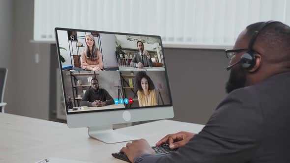 African American Businessman Having Online Business Meeting With Colleagues Making Video Call on the alt