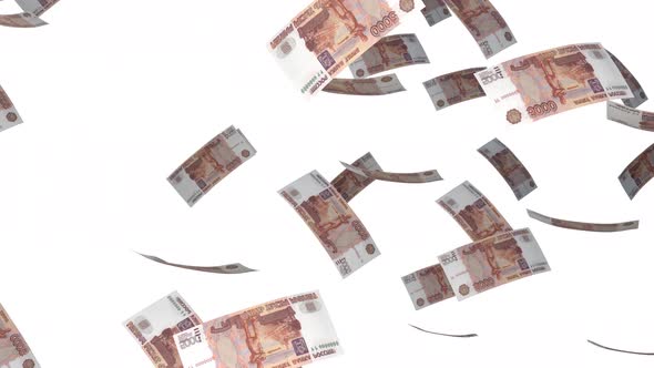 5000 Russian Ruble bills falling down. Banknotes isolated on white background. alt