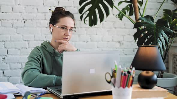 Serious White Girl Student Typing on Laptop Preparing Course Work alt