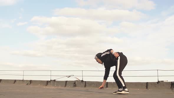 Dancer Guy Dancing Break Dance on the Roof alt