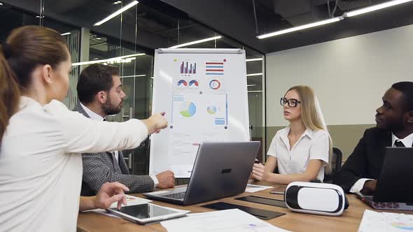 Business Mentor Working Together to Motivate His Mixed Race Purposeful Diverse Team alt
